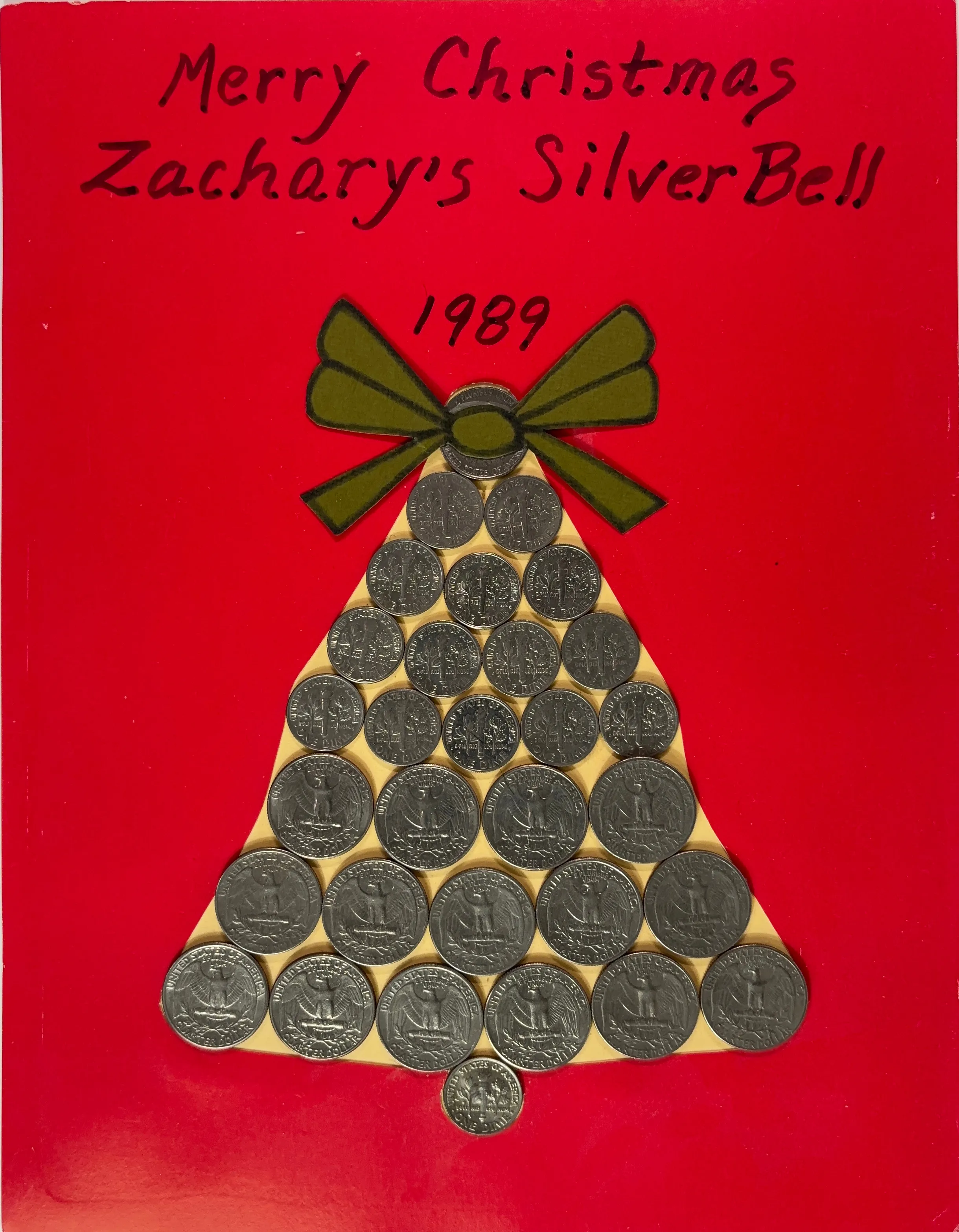A silver bell made of US Coins