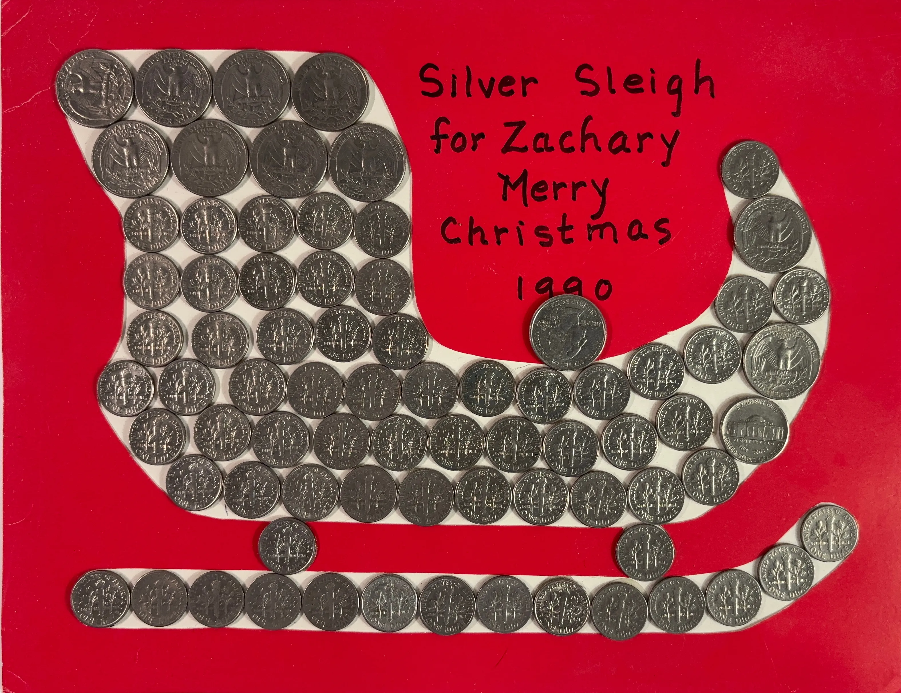 A silver sleigh made of US Coins
