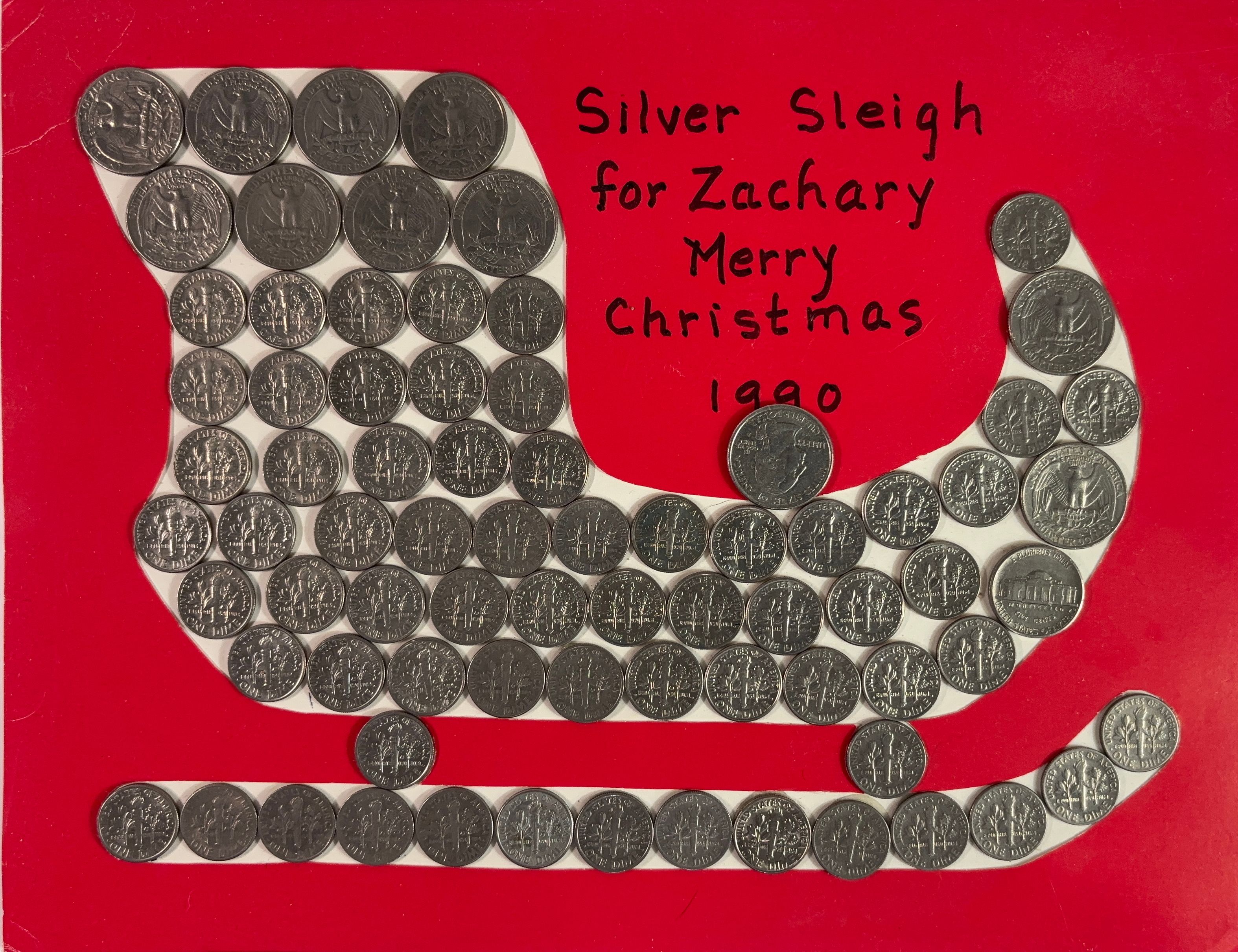 A silver sleigh made of US Coins